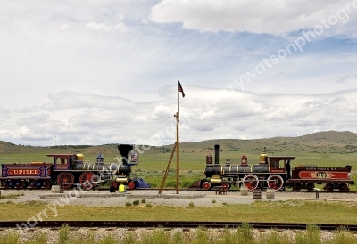 Replica locomotives that took part of the last spike been put into the rail